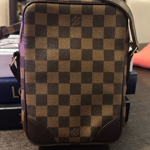 Gently used LV Danube Damier pattern with gold-tone zipper and adjustable strap - Picture 2 of 11